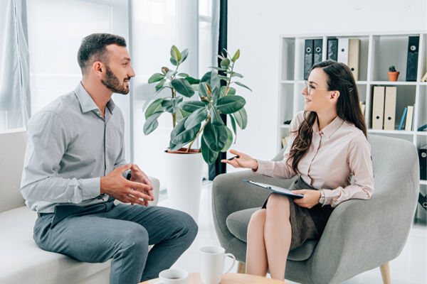 A therapist consults with a client in a modern office, highlighting the importance of choosing the right mental health provider.