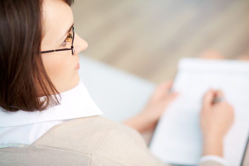 Close-up image of a psychiatrist meticulously keeping patient records, representing the detailed approach of psychiatry Phoenix AZ