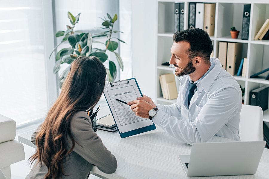 Doctor explaining United Healthcare drug rehab coverage to patient