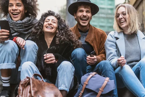 Friends laughing together, showcasing the benefits of outpatient rehab over inpatient treatment for a more flexible and social recovery journey