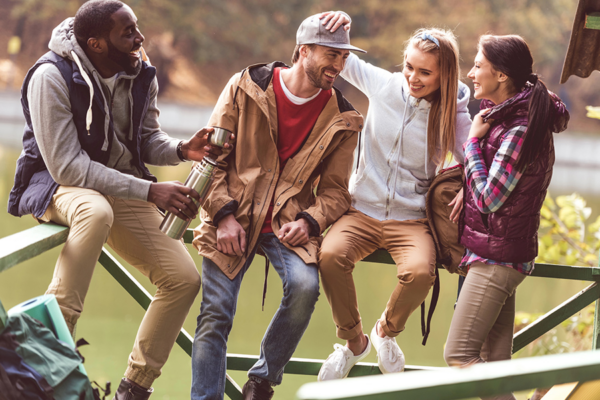 Group of diverse friends enjoying outdoor time, symbolizing sober living