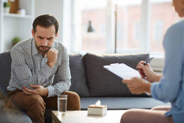 Man in a therapy session as a part of an opioid treatment program in Phoenix AZ