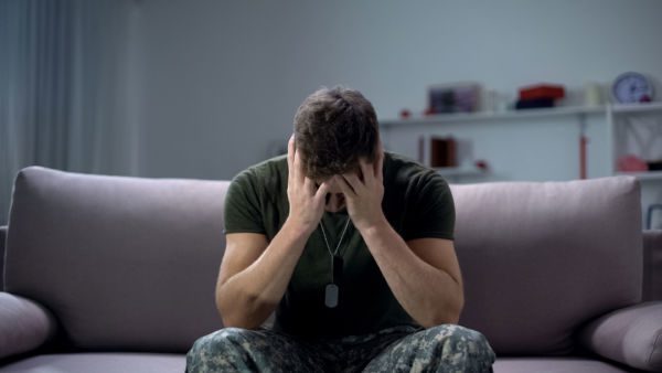 Soldier in distress symbolizing the need for PTSD and addiction treatment in Phoenix AZ 