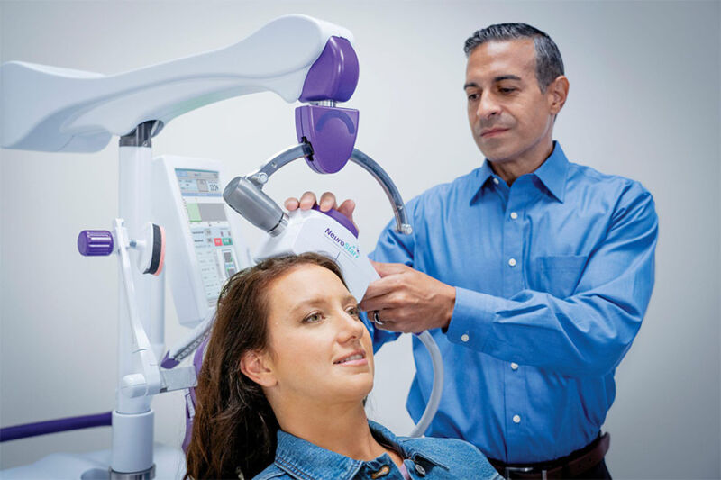 Young lady undergoing transcranial magnetic stimulation treatment in Arizona.