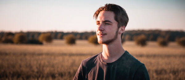 Young man looking at the horizon. Background image